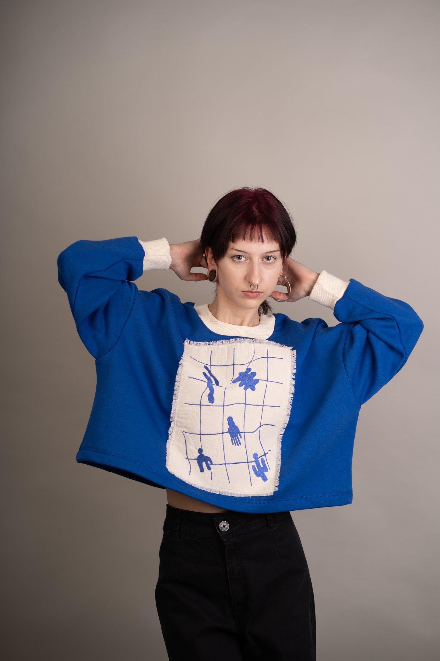 Women's graphic sweatshirt with abstract embroidery