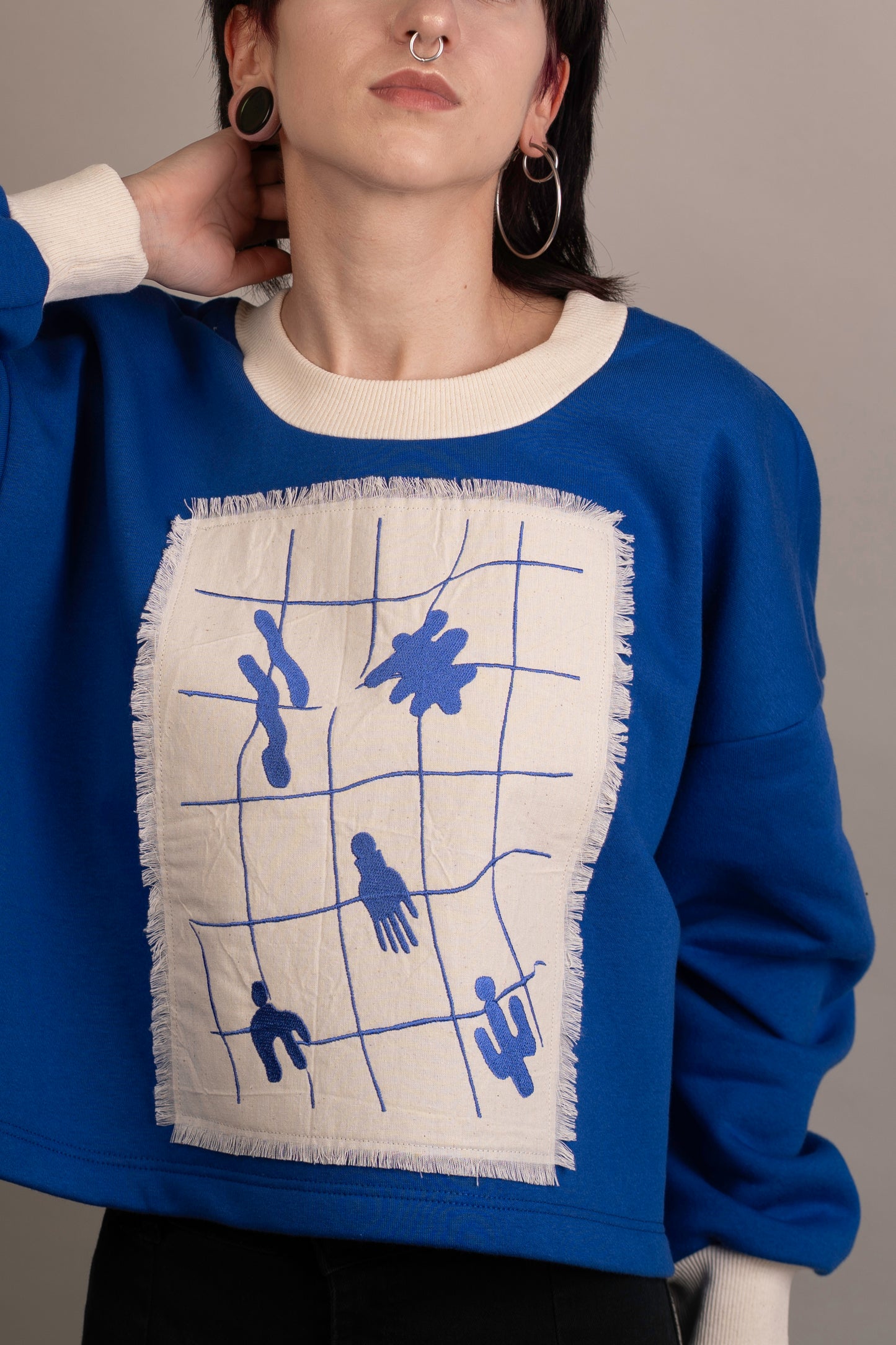 Women's graphic sweatshirt with abstract embroidery