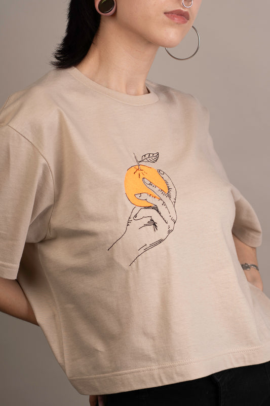 Women's graphic crop top with orange embroidery on chest