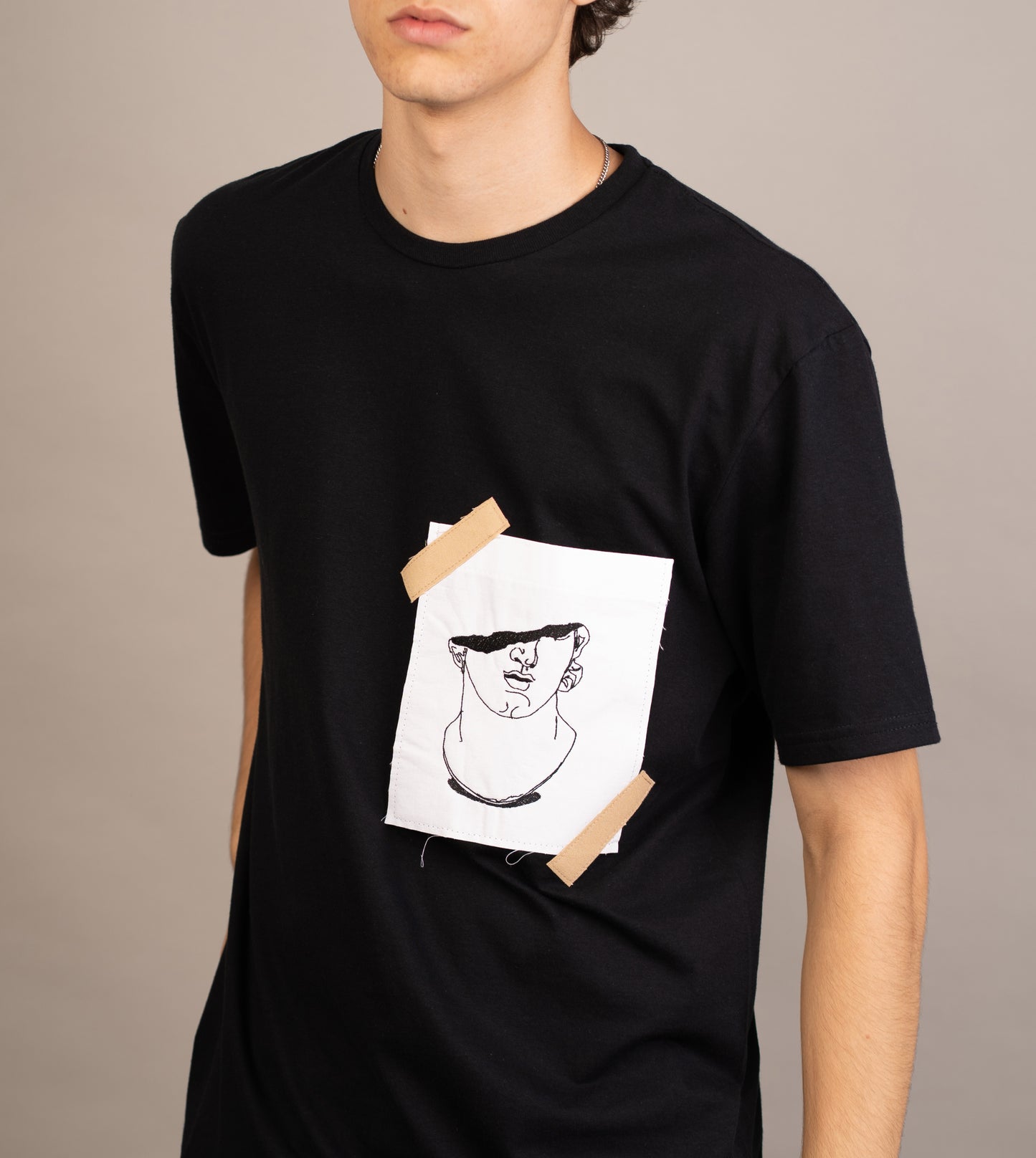 Men's T-shirt with statue on pocket