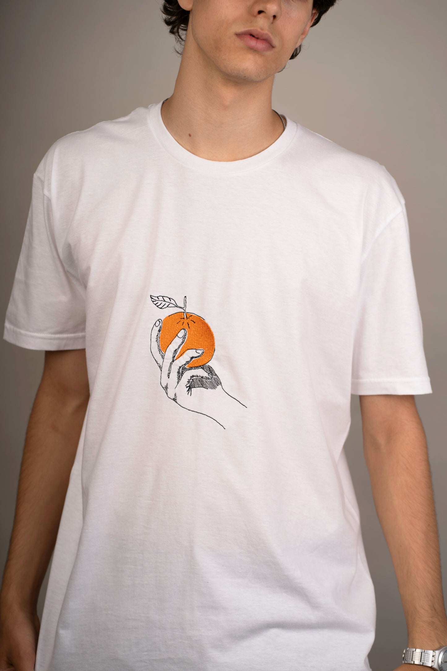 Men's graphic T-shirt with orange embroidery on chest